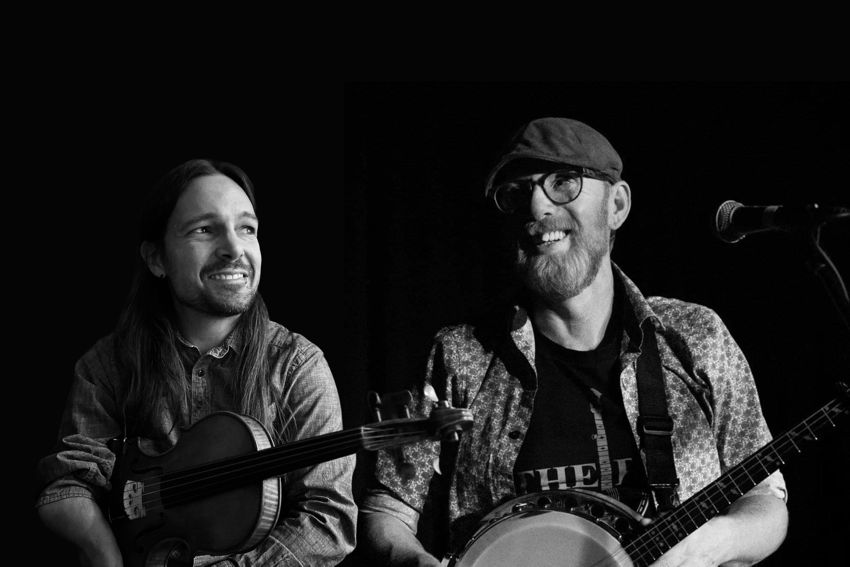 Jarred Albright and David Morrissey with fiddle and banjo.